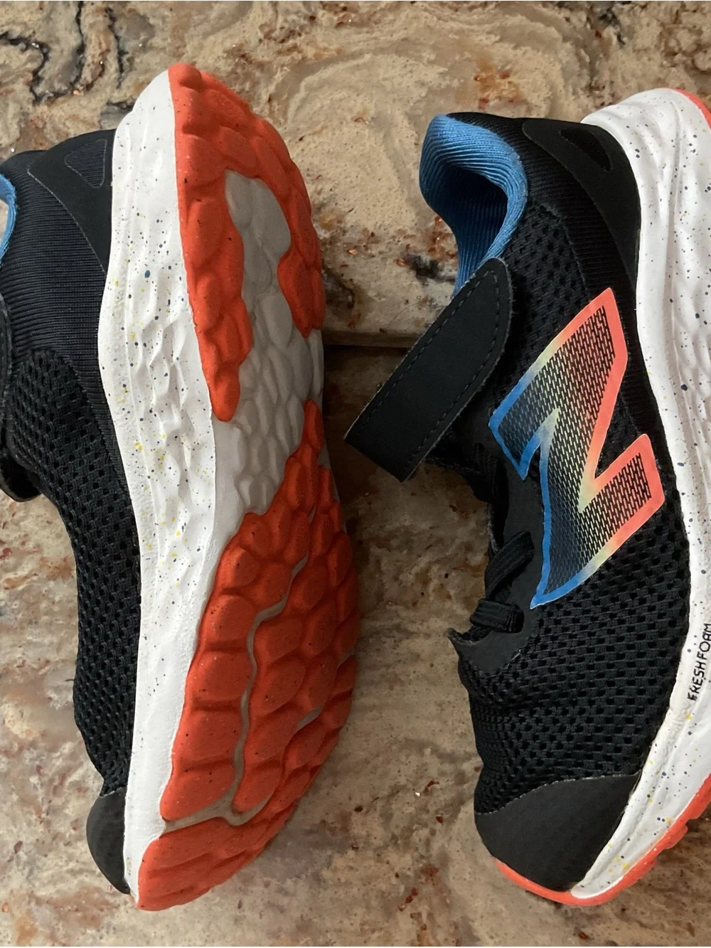 New Balance Kids Black Sneakers with Blue Lining and Coral Accent